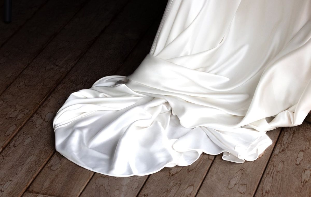 Mariage — préparatifs, traîne de la robe sur le parquet